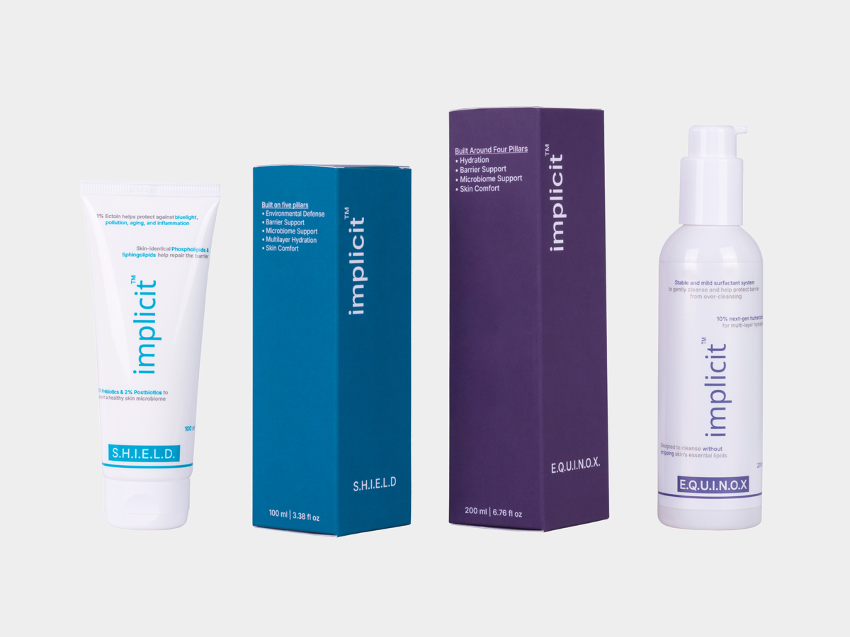 Brand Implicit skincare duo featuring E.Q.U.I.N.O.X. gentle hydrating cleanser and S.H.I.E.L.D. barrier repair gel cream with product boxes.